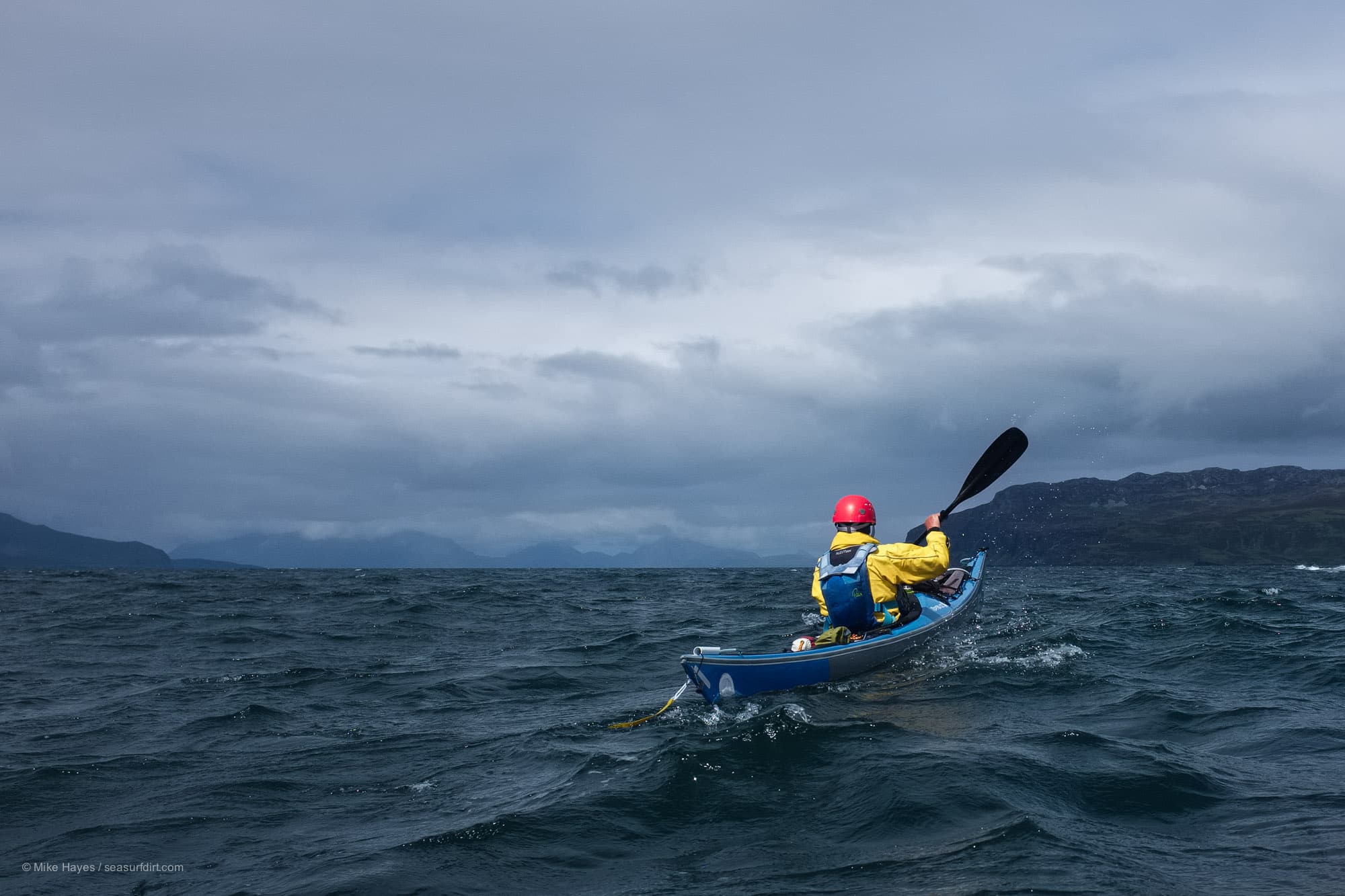 Sea kayaking between the Isle of Muck and the Isle of Eigg in stormy weather